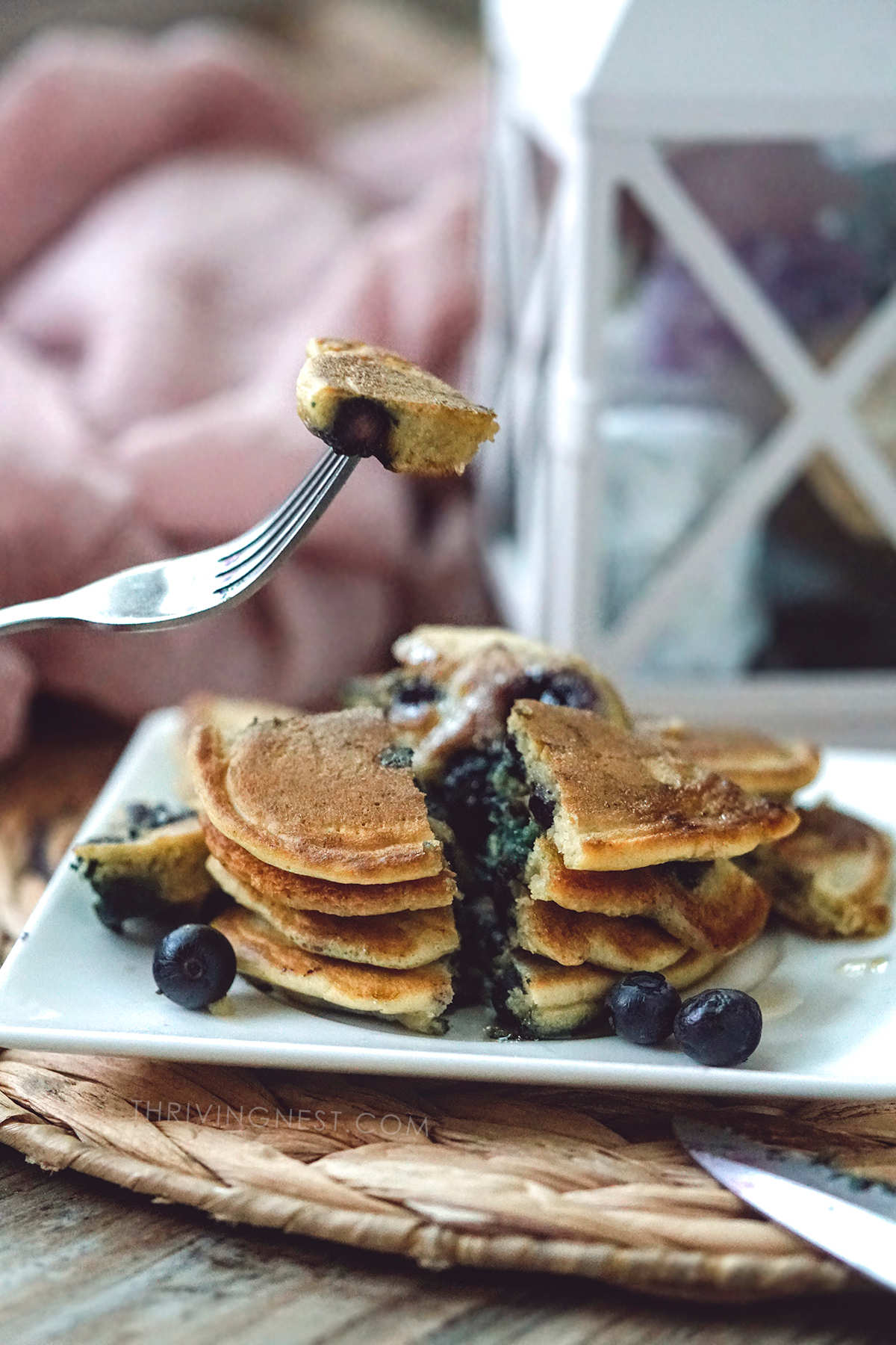 Cut and serve blueberry pancakes for baby.