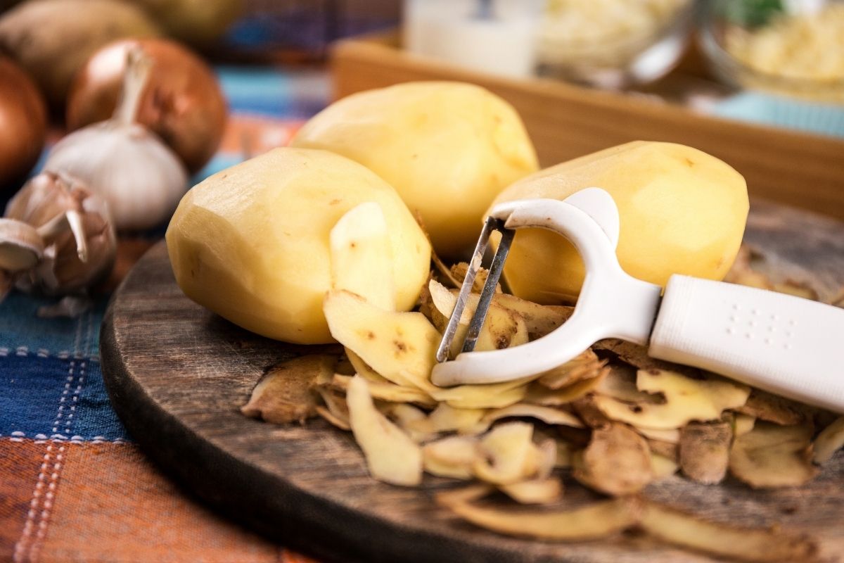 Peeling potatoes.