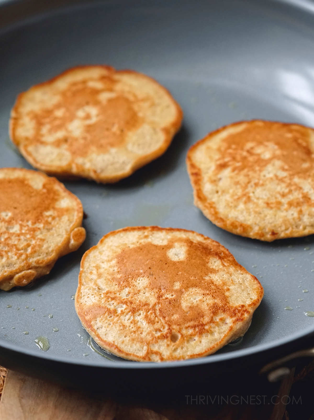 Cooking apple pancakes for babies on a non-stick skillet.