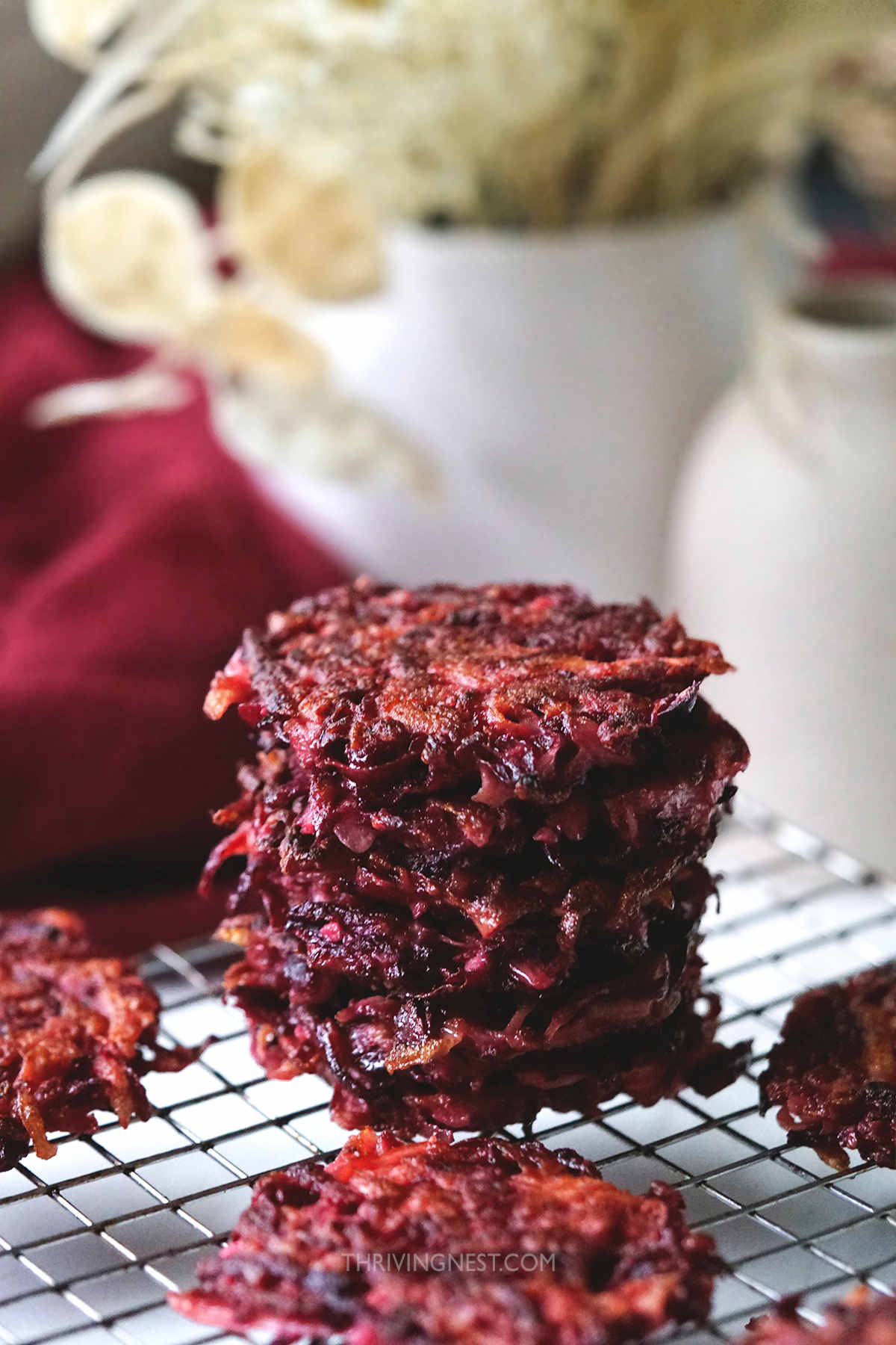 Beet fritters/patties or latkes made with grated beetroot, potato and apple.