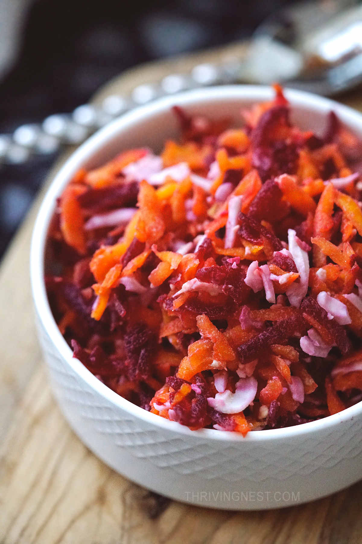 Close up shot of carrot salad in a bowl.