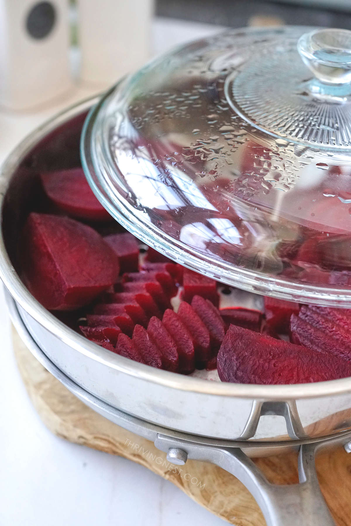 Steaming beetroot cut into cubes strips or rounds for babies as baby led weaning.