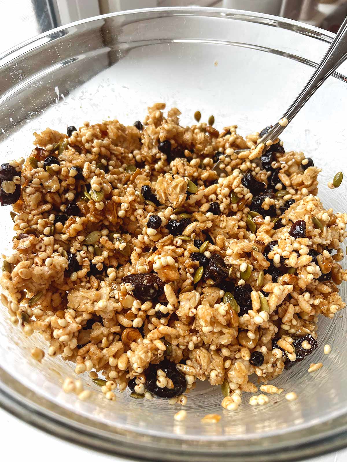 Picture showing  all granola ingredients mixed in a bowl.