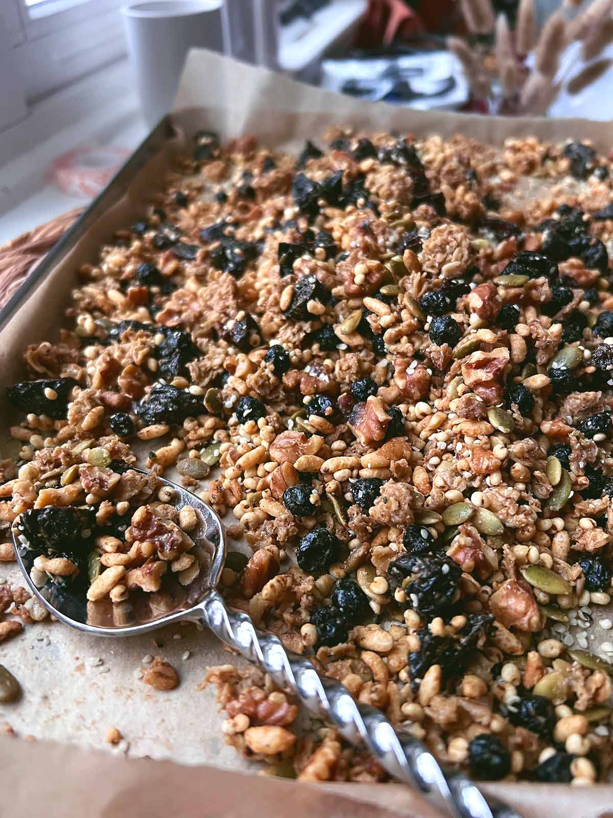 Picture showing the final granola after baking, cooling down in the baking sheet.