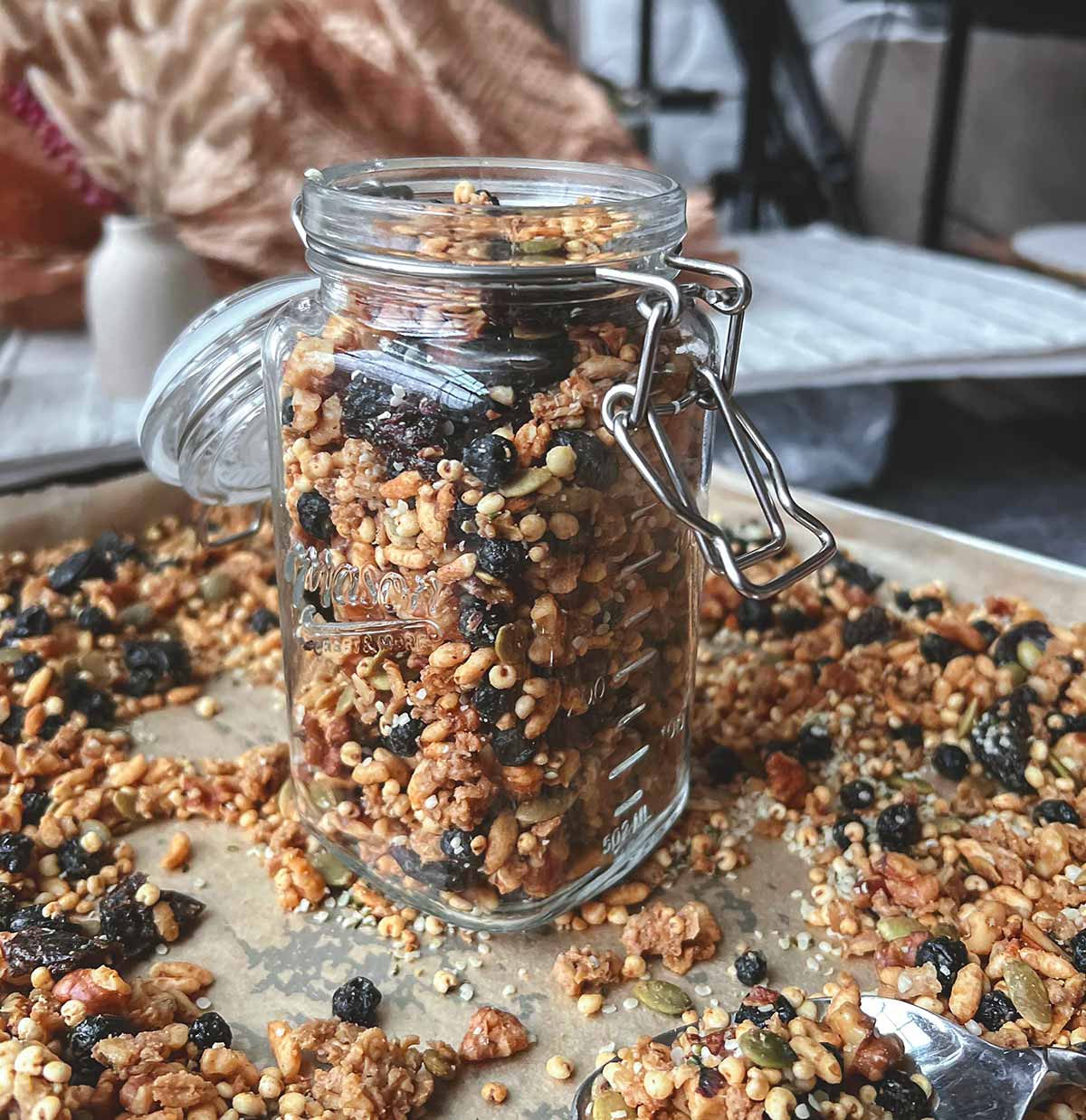 Granola stored in a glass jar with a lid.