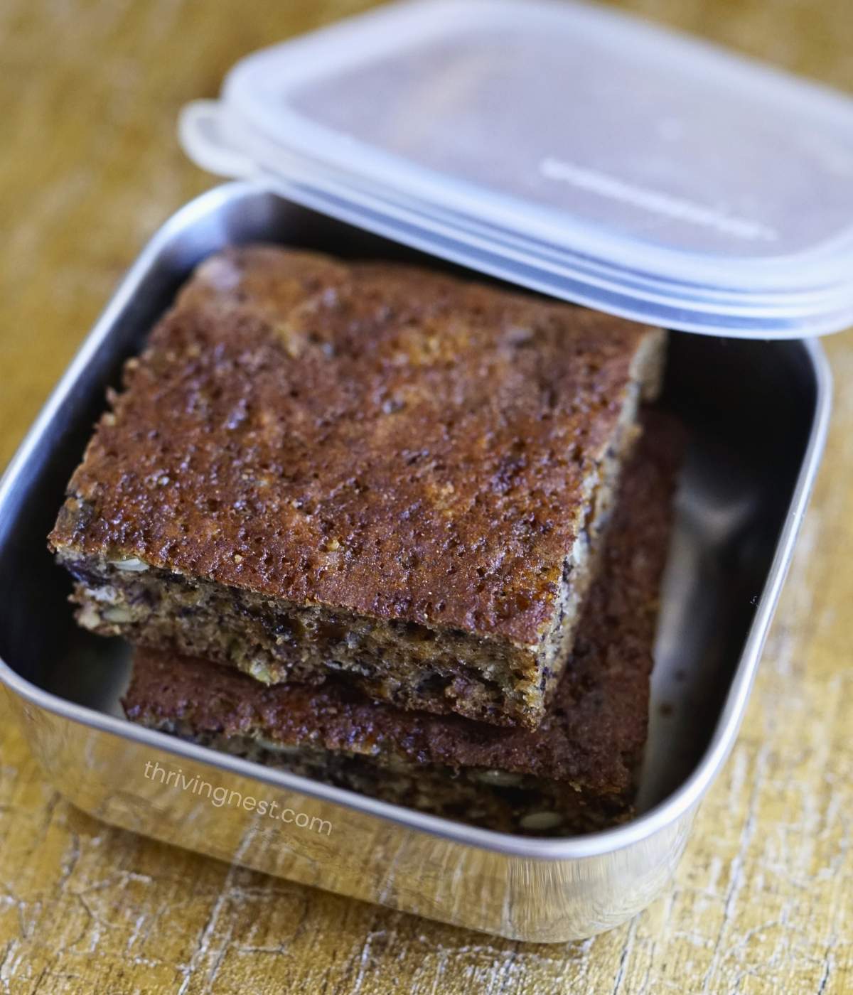 Homemade banana pancake squares packed in a school lunchbox as snack